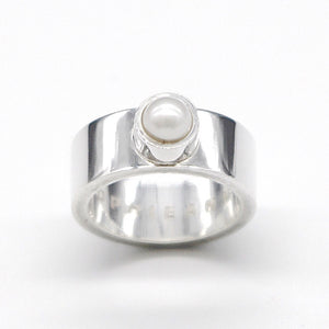 A stunning stacking ring, featuring a freshwater pearl. Handcrafted in recycled sterling silver.