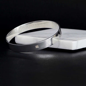 wide, minimal-style bangle in sterling silver