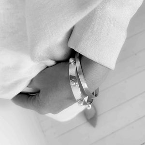 Lifestyle—model wearing freshwater pearl bangle with crisp white tee, elevated basics | SOPHIE ANNA
