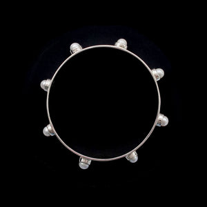 Close-up of freshwater pearl bangle in recycled sterling silver — | SOPHIE ANNA