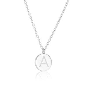 Dainty Small Disc Initial Necklace, elegantly engraved with a personalized initial, designed for everyday wear— a classic piece symbolizing closeness to a loved one's name.