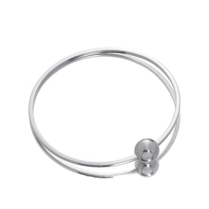 Lightweight and elegant Single Ball Bangle crafted from recycled sterling silver, featuring a unique sliding ball along a flat-edged band for easy, chic wear.