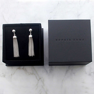 a beautiful gift wrapped pair of long tassel and ball earrings