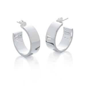 Stunning, sterling silver, chunky hoop earrings displayed on a white background